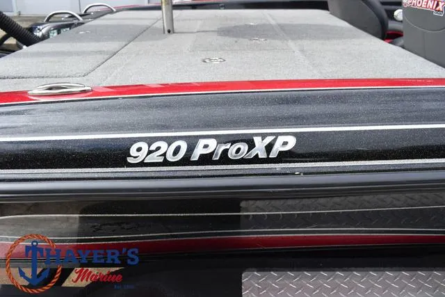 Slide: The Image of 2017 Phoenix Bass Boats 920 ProXP, black and red detailing, Thayer's Marine logo visible. - 5