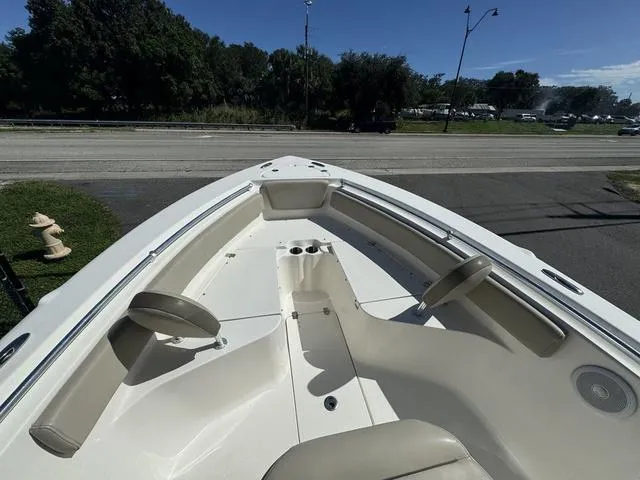 Slide: The Image of 2022 Key West 239FS boat interior with seating and cup holders. - 6