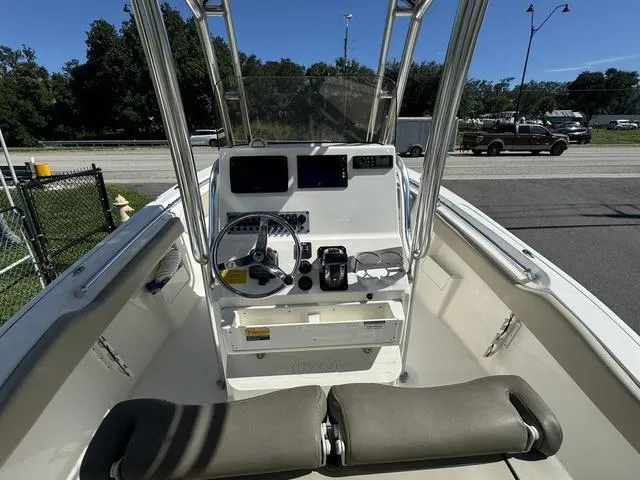 Slide: The Image of 2022 Key West 239FS boat cockpit with steering wheel and controls. - 8