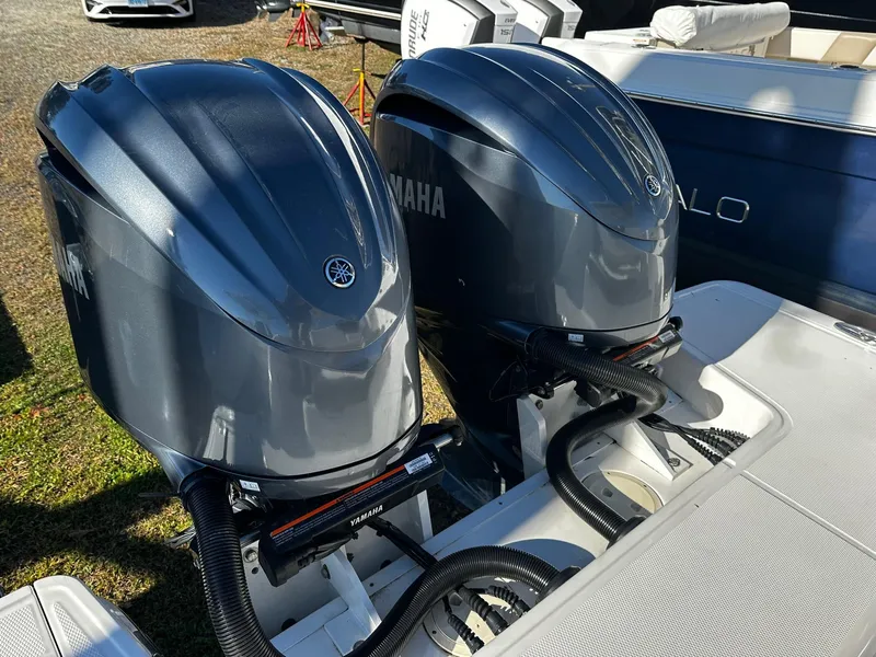 Slide: The Image of Twin Yamaha outboard engines on a 2022 Robalo R317 Dual Console boat. - 13