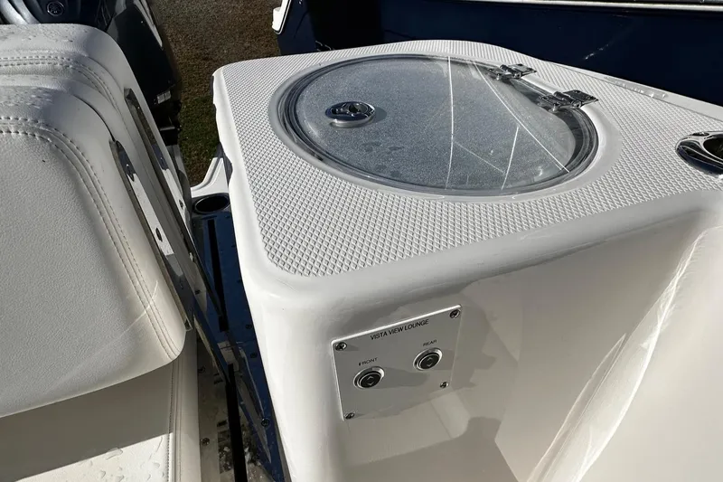 Slide: The Image of 2022 Robalo R317 Dual Console boat with livewell and seating area. - 20