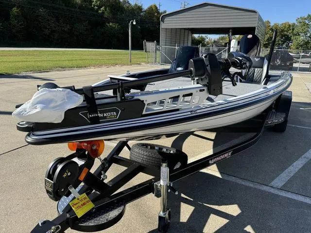 Slide: The Image of 2025 Phoenix 721 ZXL boat on trailer, parked outdoors. - 10
