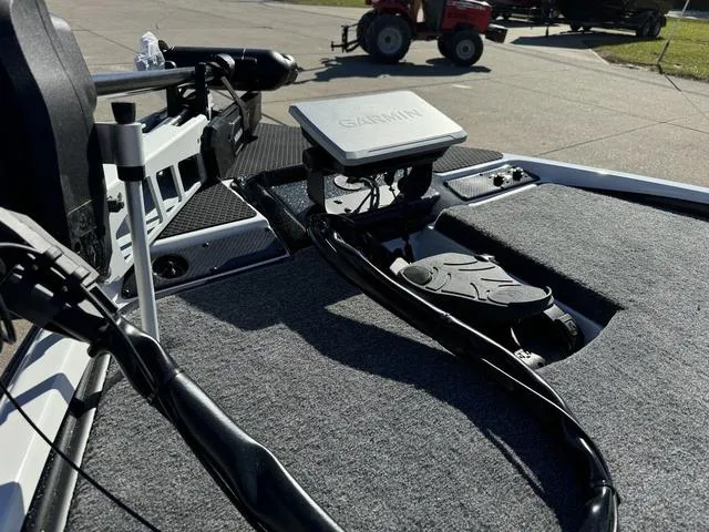 Slide: The Image of 2025 Phoenix 721 ZXL boat deck with Garmin navigation system and trolling motor. - 12