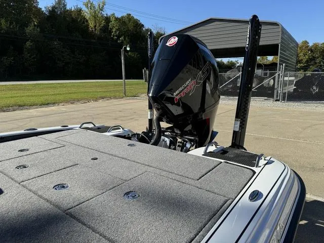 Slide: The Image of 2025 Phoenix 721 ZXL boat with Mercury engine, parked outdoors. - 15