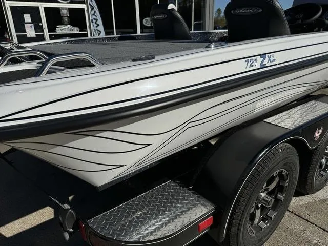 Slide: The Image of 2025 Phoenix 721 ZXL boat on trailer, sleek design with black accents. - 3