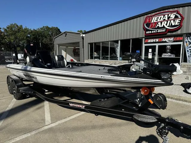 Slide: The Image of 2025 Phoenix 721 ZXL boat at Weda's Marine dealership. - 9