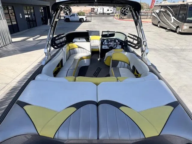 Slide: The Image of 2015 MB SPORTS B52 23 boat interior with modern seating and dashboard. - 11