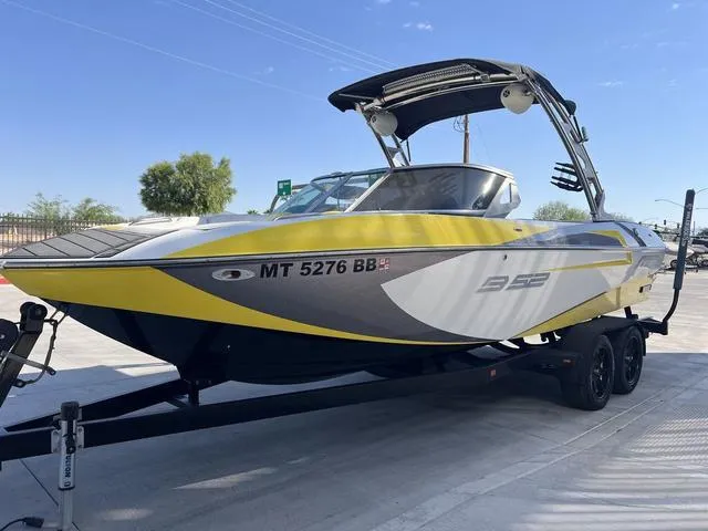 Slide: The Image of 2015 MB SPORTS B52 23 boat on trailer, yellow and gray design. - 4