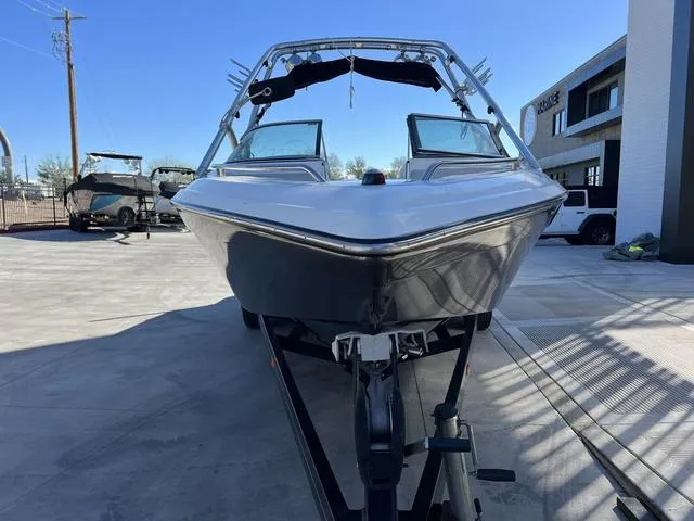 Slide: The Image of 2008 Supreme V232 boat on trailer, parked outdoors. - 3