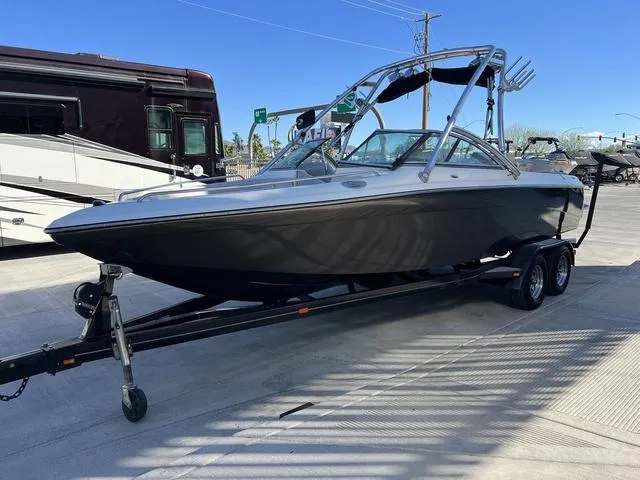 Slide: The Image of 2008 Supreme V232 boat on trailer in outdoor setting. - 4