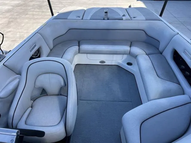 Slide: The Image of 2008 Supreme V232 boat interior with gray seating and carpet. - 8