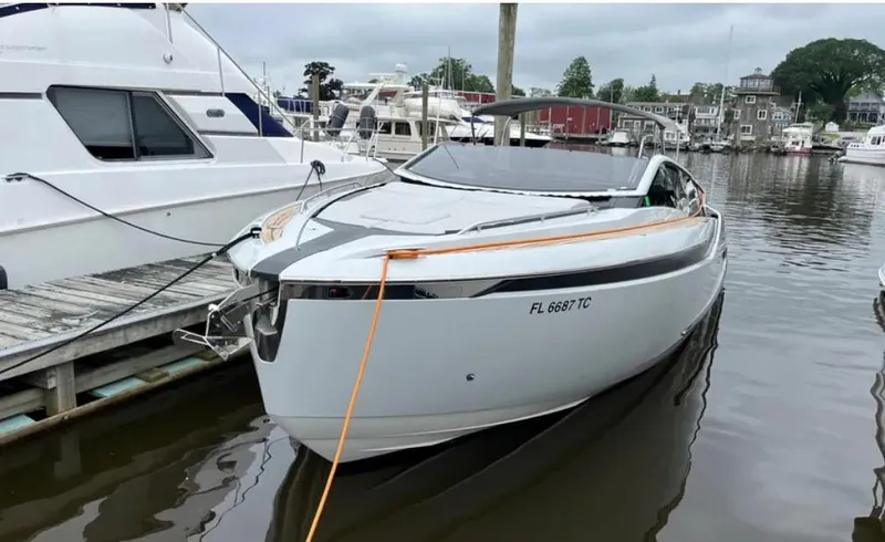 Slide: The Image of 2022 Fairline F//Line 33 yacht docked in a marina. - 22