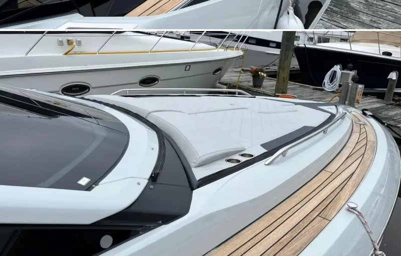 Slide: The Image of 2022 Fairline F//Line 33 yacht with sleek design and wooden deck at marina. - 24