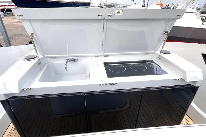 Slide: The Image of Outdoor kitchen on 2022 Fairline F//Line 33 yacht with sink and stove. - 30