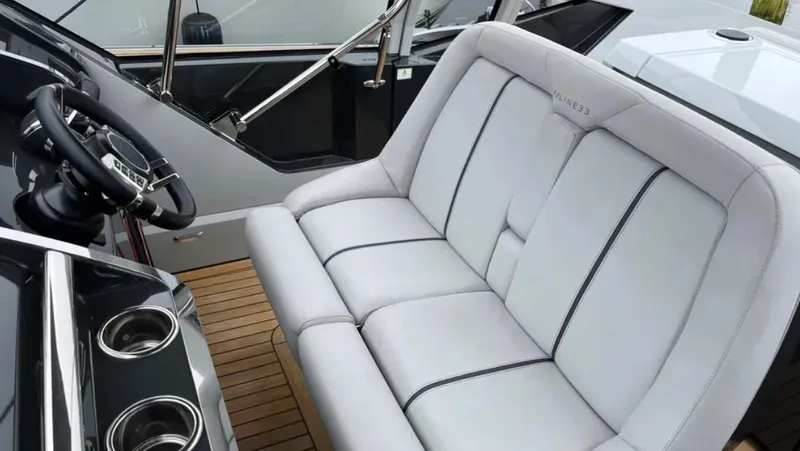 Slide: The Image of Luxury seating on 2022 Fairline F//Line 33 yacht with sleek design and modern features. - 32