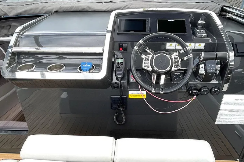 Slide: The Image of Fairline F//Line 33 2022 yacht dashboard with modern controls and navigation system. - 35