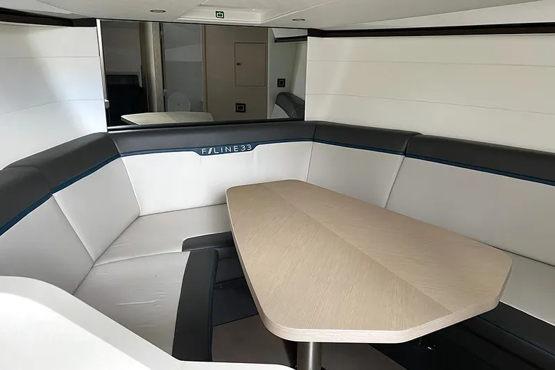 Slide: The Image of Luxurious interior of 2022 Fairline F//Line 33 yacht with elegant seating and table. - 39
