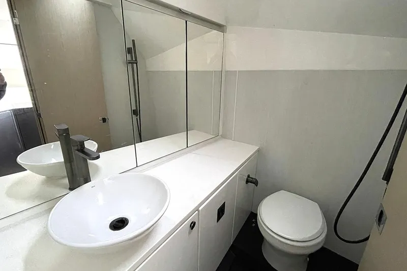 Slide: The Image of Modern bathroom in 2022 Fairline F//Line 33 yacht with sleek fixtures and mirror. - 41