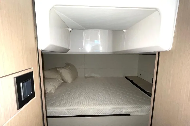 Slide: The Image of Interior cabin of 2022 Fairline F//Line 33 yacht with bed and pillows. - 42