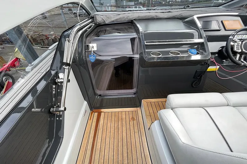Slide: The Image of 2022 Fairline F//Line 33 yacht interior with sleek design and wooden flooring. - 44