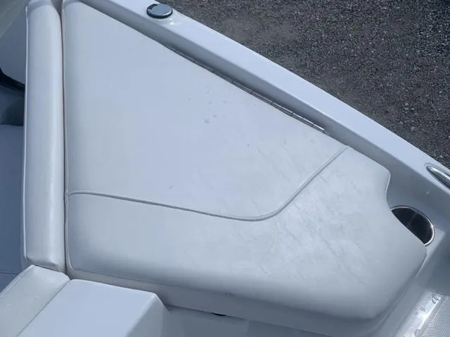Slide: The Image of 2024 Tahoe 210 S boat seating area with white upholstery. - 14