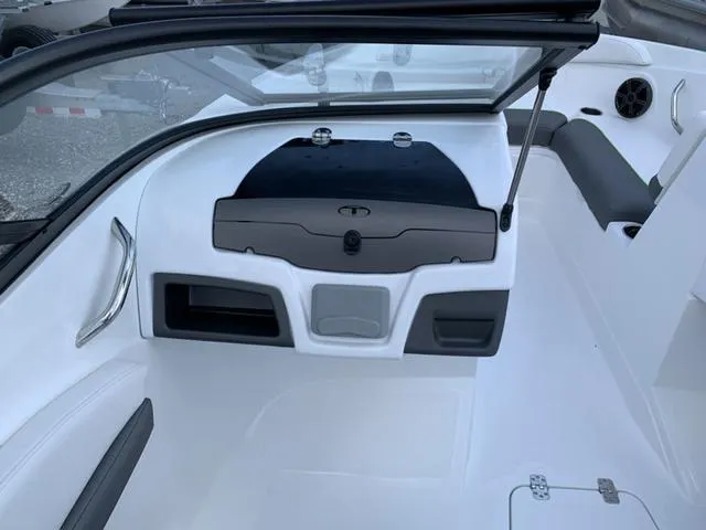 Slide: The Image of 2024 Tahoe 210 S boat interior with sleek white design and modern dashboard. - 40