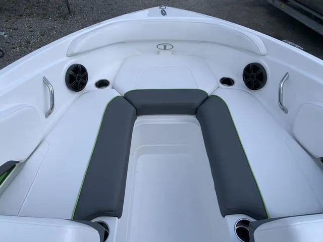 Slide: The Image of 2024 Tahoe 210 S boat interior with gray and white seating, speakers, and handles. - 43