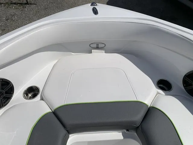 Slide: The Image of 2024 Tahoe 210 S boat interior with white and gray seating. - 46