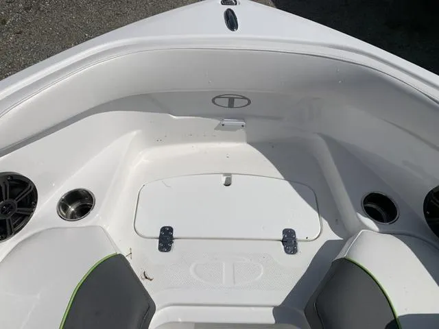 Slide: The Image of 2024 Tahoe 210 S boat interior with seating and storage compartments. - 47