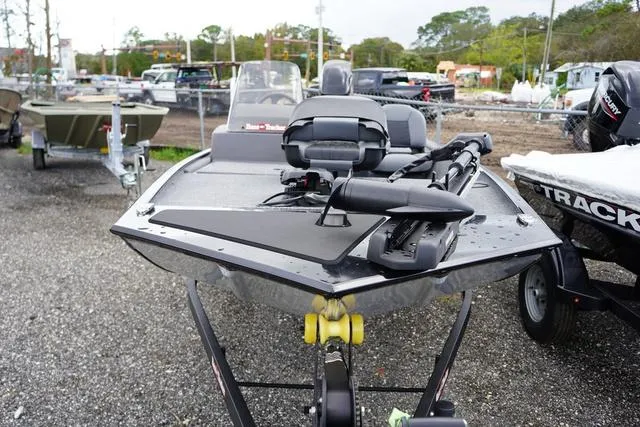 Slide: The Image of 2025 Tracker CLASSIC XL boat on trailer, parked outdoors. - 3