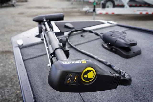 Slide: The Image of 2025 Tracker CLASSIC XL boat with Minn Kota trolling motor on deck. - 8