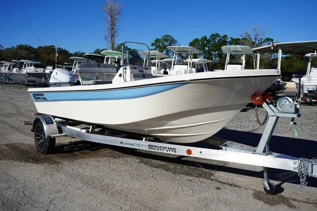 Slide: The Image of 2025 Carolina Skiff 178 JLS boat on trailer, parked outdoors. - 1