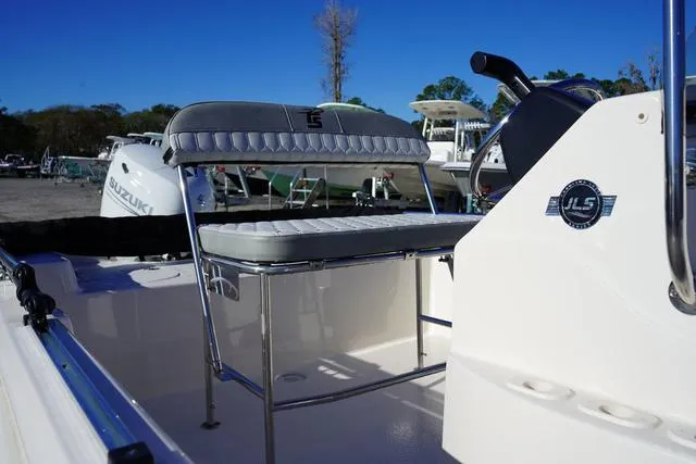 Slide: The Image of 2025 Carolina Skiff 178 JLS boat interior with seating and console. - 10