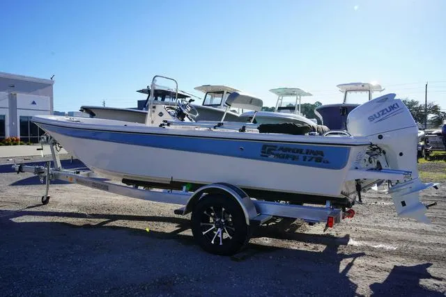 Slide: The Image of 2025 Carolina Skiff 178 JLS boat on trailer, outdoor display. - 5