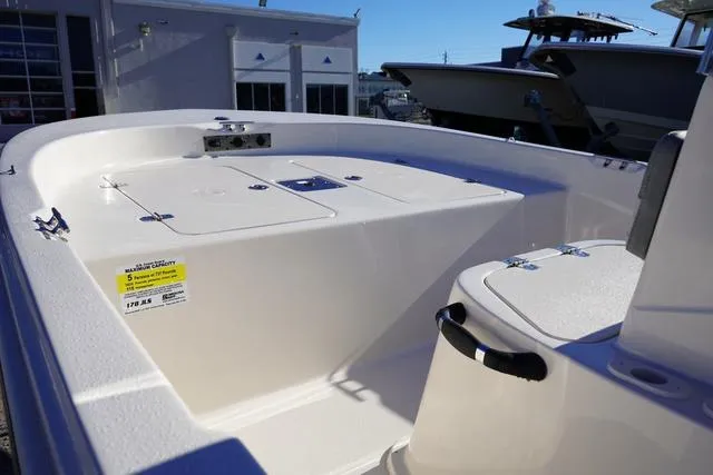 Slide: The Image of 2025 Carolina Skiff 178 JLS boat interior with storage compartments. - 8