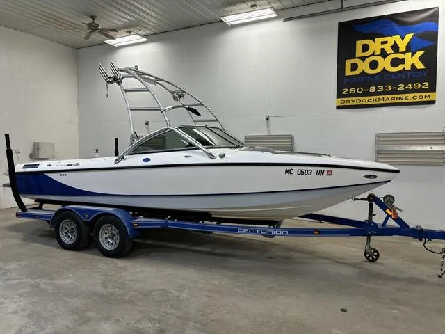 Slide: The Image of 2006 Centurion Elite Air Warrior C4 boat on trailer in showroom. - 1