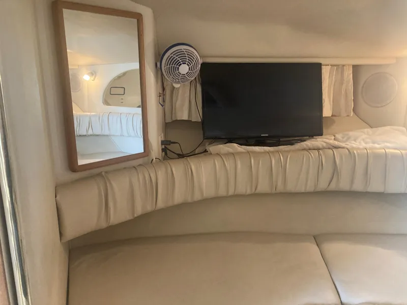 Slide: The Image of Interior of 1999 Sea Ray 330 Express Cruiser with TV and mirror. - 13