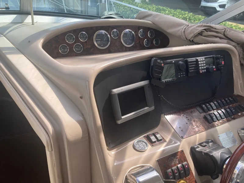 Slide: The Image of 1999 Sea Ray 330 Express Cruiser dashboard with gauges and navigation equipment. - 30