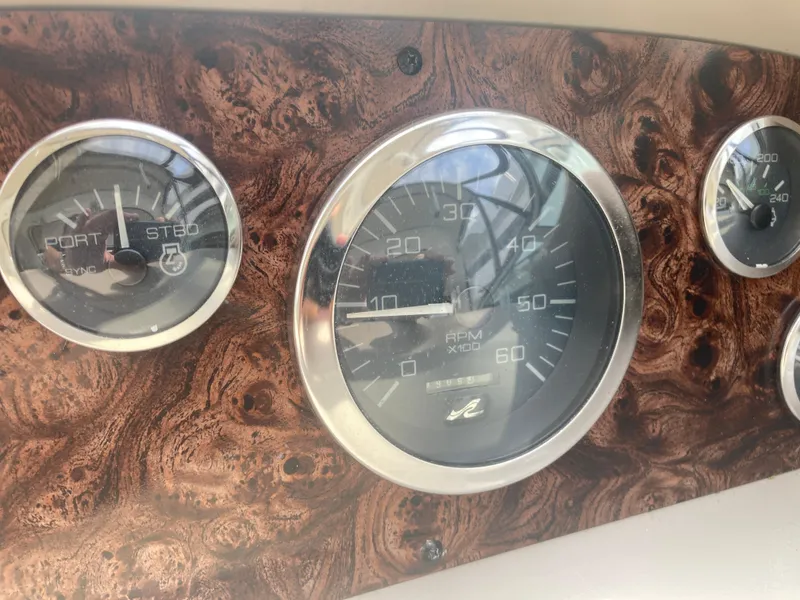 Slide: The Image of Dashboard gauges of a 1999 Sea Ray 330 Express Cruiser boat. - 33