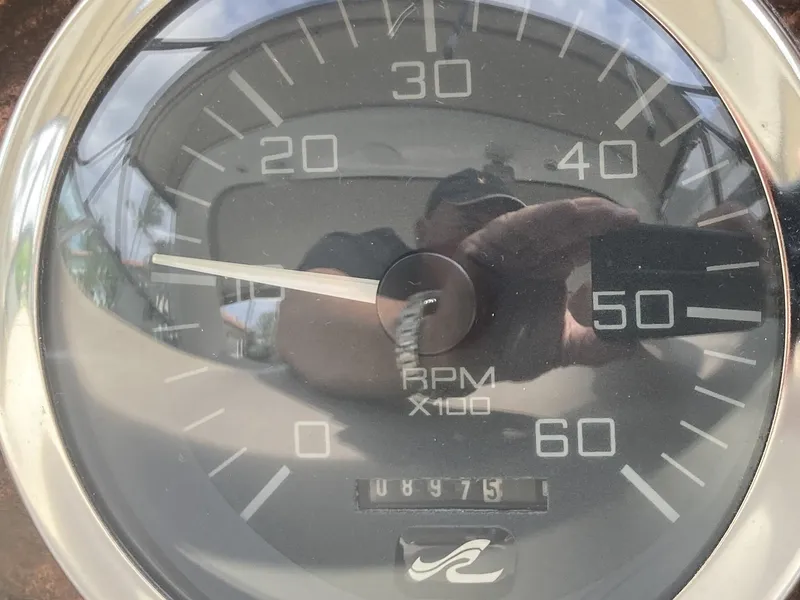 Slide: The Image of Close-up of 1999 Sea Ray 330 Express Cruiser RPM gauge showing 8475. - 34