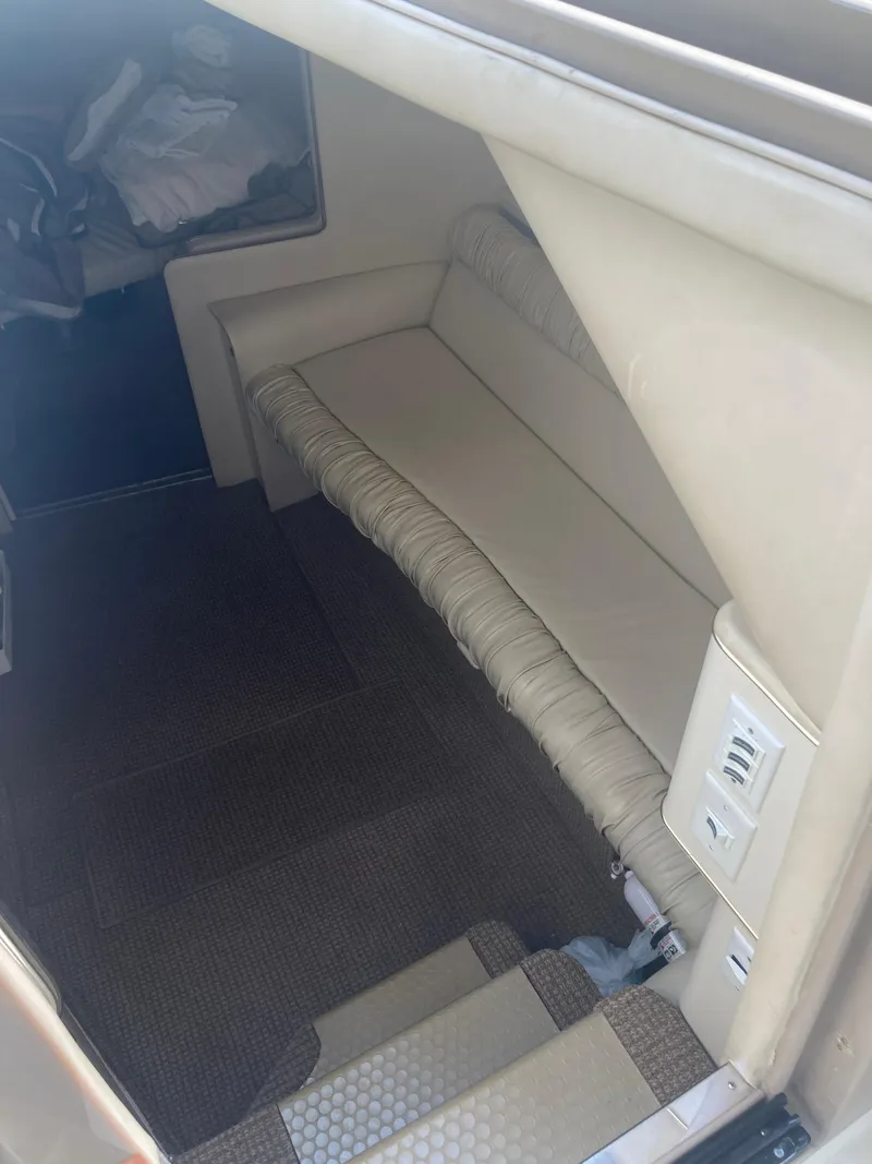 Slide: The Image of 1999 Sea Ray 330 Express Cruiser interior cabin with beige seating. - 39