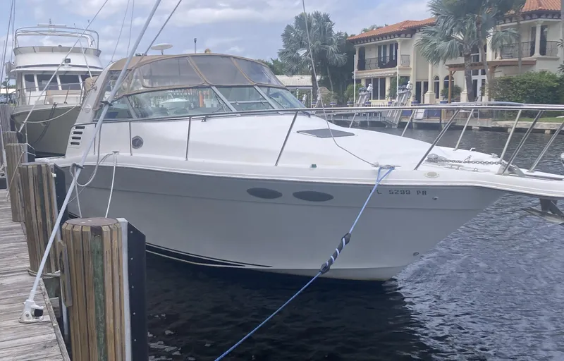 Slide: The Image of 1999 Sea Ray 330 Express Cruiser docked at marina. - 5