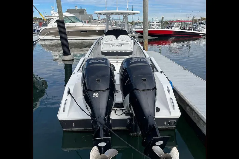Slide: The Image of 2013 Cigarette 39 Top Gun Open boat with twin engines docked in marina. - 14