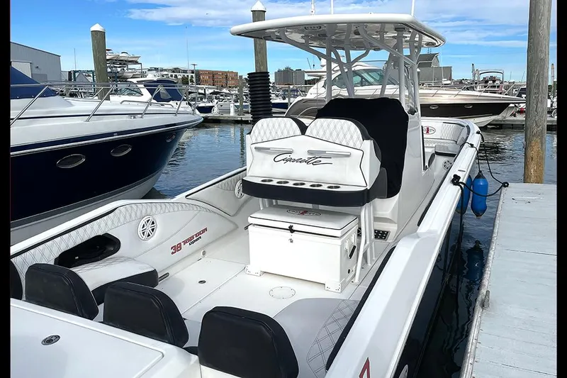 Slide: The Image of 2013 Cigarette 39 Top Gun Open boat docked at marina, featuring sleek design and spacious seating. - 3
