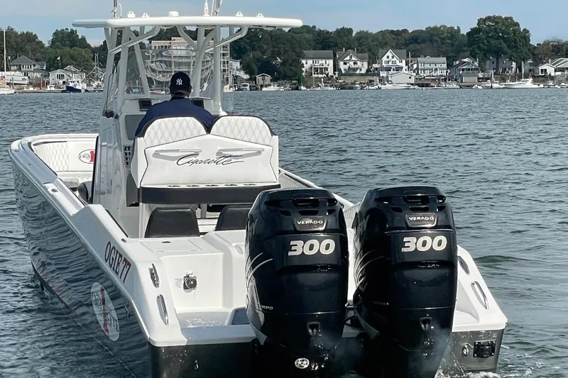 Slide: The Image of 2013 Cigarette 39 Top Gun Open boat with twin 300 Verado engines on water. - 4