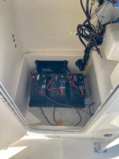 Slide: The Image of 2022 Bulls Bay 230 Center Console boat battery compartment with wiring. - 13
