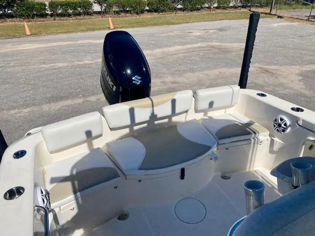 Slide: The Image of 2022 Bulls Bay 230 Center Console boat interior with seating and motor. - 15