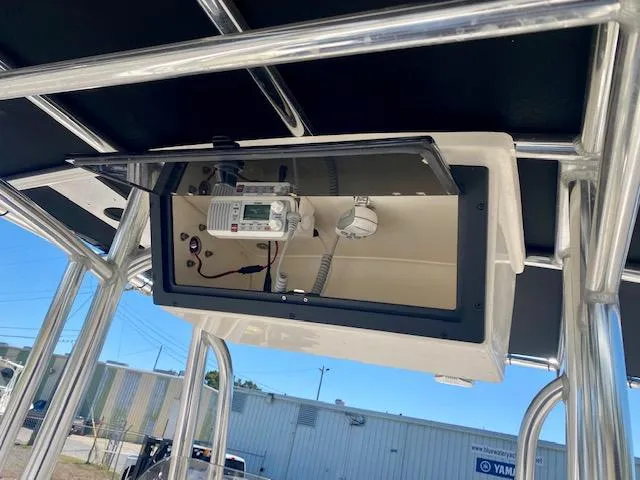 Slide: The Image of 2022 Bulls Bay 230 Center Console boat with mounted electronics under T-top. - 18