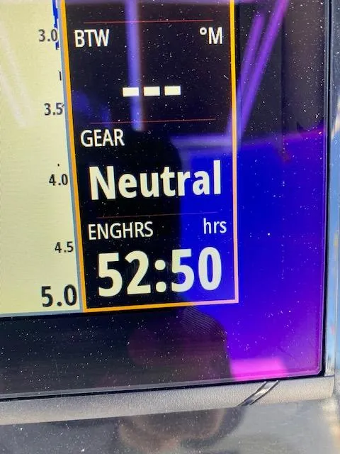 Slide: The Image of Bulls Bay 230 Center Console 2022 boat display showing 52:50 engine hours in neutral gear. - 19