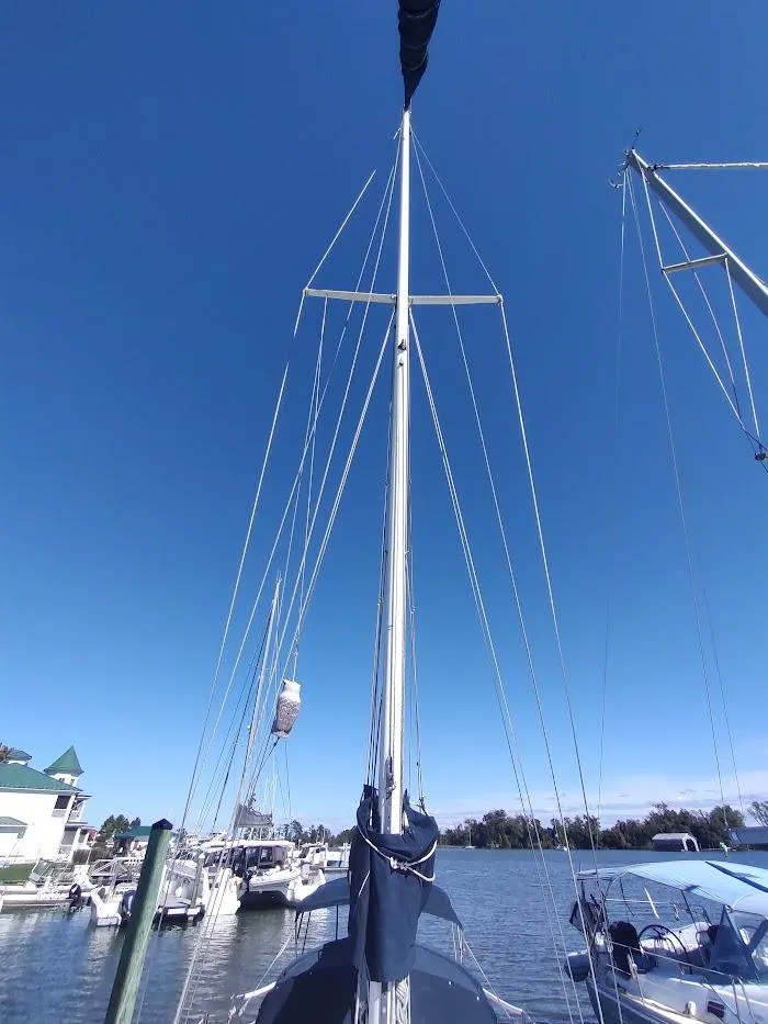Slide: The Image of Sailboat mast of 1990 Catalina C-34 against clear blue sky at marina. - 11
